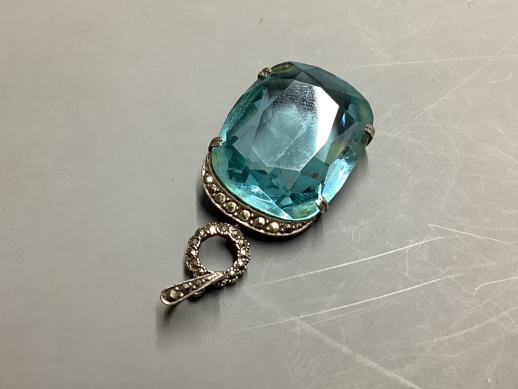 A continental white metal (stamped 935), blue paste and marcasite set pendant